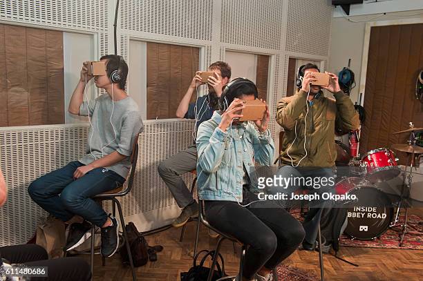 Members of the public view a Virtual Reality video which offers viewers a tour of the famous Abbey Road recording studios using the Google Cardboard...