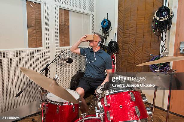 Member of the public views a Virtual Reality video which offers viewers a tour of the famous Abbey Road recording studios using the Google Cardboard...