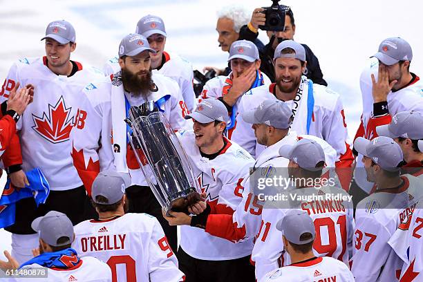 Sidney Crosby of Team Canada lifts the World Cup Trophy after Team Canada defeated Team Europe 2-1 in Game Two of the World Cup of Hockey final...