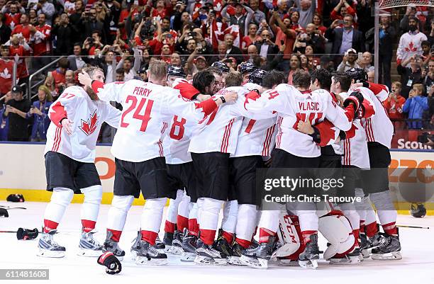 Team Canada celebrates after the 2-1 win against Team Europe during Game Two of the World Cup of Hockey final series at the Air Canada Centre on...