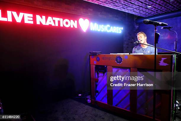 Coldplay's Chris Martin sings onstage during a special performance hosted by Live Nation to benefit MusiCares, a charity of The Recording Academy, at...