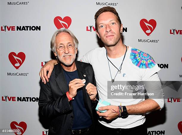 National Academy of Recording Arts and Sciences President Neil Portnow and Singer Chris Martin attend a special performance by Coldplay's Chris...