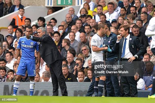 Chelsea manager Jose Mourinho and Tottenham Hotspur manager Andre Villas-Boas speak with their players on the touchline