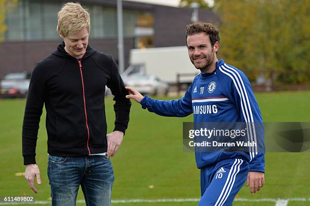 Chelsea's Juan Mata has a kick about with world snooker number one, and big Chelsea supporter, Neil Robertson after a training session at the Cobham...