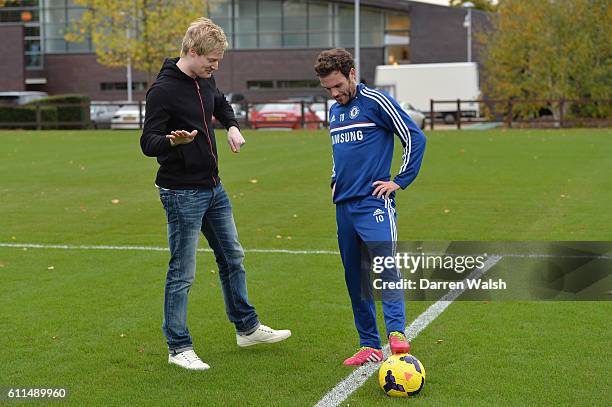 Chelsea's Juan Mata has a kick about with world snooker number one, and big Chelsea supporter, Neil Robertson after a training session at the Cobham...