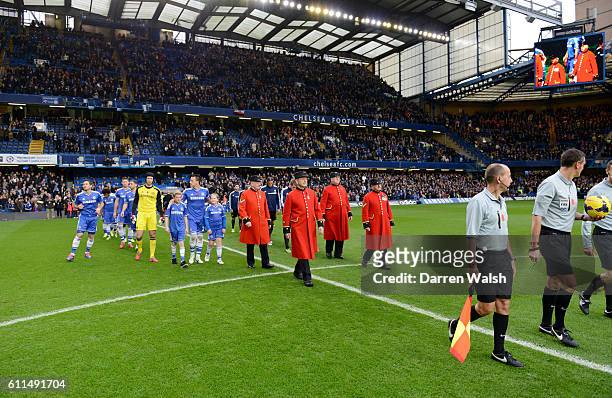 Chelsea and West Bromwich Albion are led out onto the pitch by Chelsea pensioners