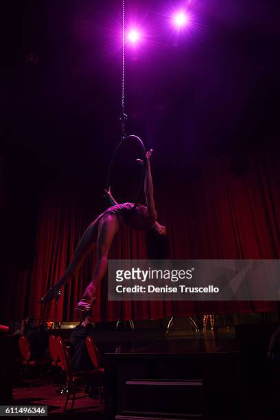 An aerialist performs at the "Cherry Boom Boom" grand opening at the Tropicana Theater at Tropicana Las Vegas on September 29, 2016 in Las Vegas,...