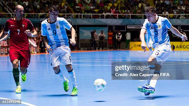 Maximiliano Rescia of Argentina shoots on goal next to his teammate Cristian Borruto and Cardinal of Portugal during the FIFA Futsal World Cup...