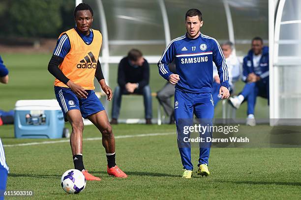 Chelsea's John Obi Mikel, Eden Hazard during a training session at the Cobham Training Ground on 14th March 2014 in Cobham, England.