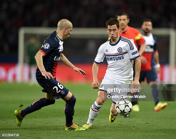 Paris Saint-Germain's Christophe Jallet and Chelsea's Eden Hazard battle for the ball