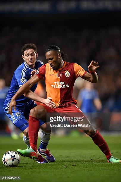 Chelsea's Frank Lampard and Galatasaray's Didier Drogba battle for the ball