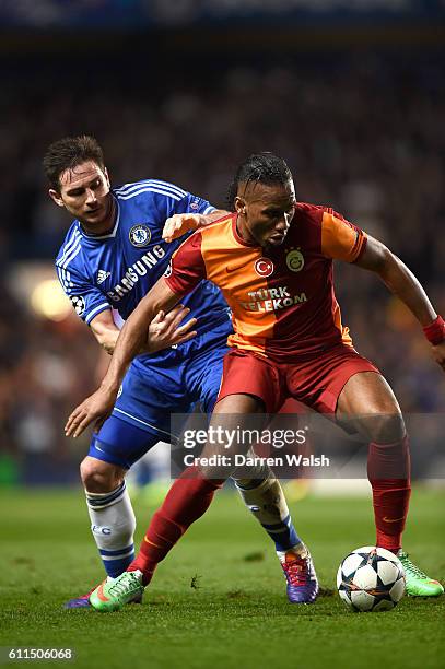 Chelsea's Frank Lampard and Galatasaray's Didier Drogba battle for the ball