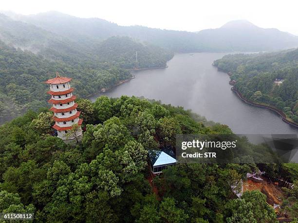This photo taken on September 29, 2016 shows a glass-walled public toilet in Shiyan Lake scenic area in Changsha, central China's Hunan province. The...