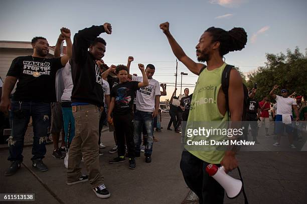 People gather to protest at the site where an unarmed black man, Alfred Olango was shot by police earlier this week on September 29, 2016 in El...