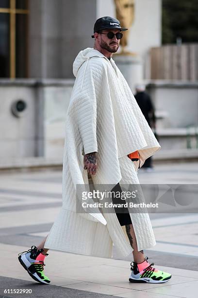 Storm Pedersen is wearing a white full outfit, outside the Anne Demeulemeester show, at Trocadero, during Paris Fashion Week Spring Summer 2017, on...