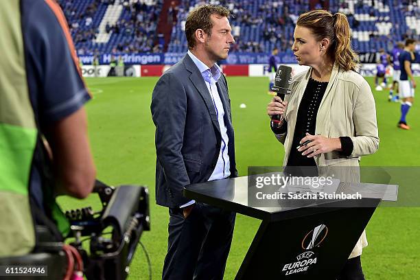 Presenter Laura Wontorra talks to head coach Markus Weinzierl of Schalke prior to the UEFA Europa League match between FC Schalke 04 and FC Salzburg...