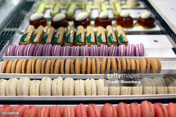 Macaroons sit on a counter during the opening of the Dominique Ansel Bakery in London, U.K., on Friday, Sept. 30, 2016. The Dominique Ansel Bakery,...