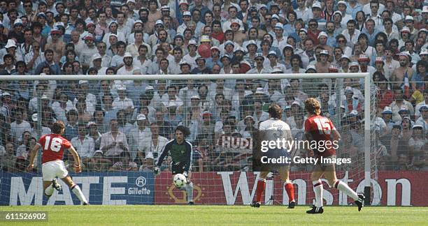 England player Bryan Robson scores past goalkeeper Jean-Luc Ettori to put England ahead after just 27 seconds during their opening 1982 FIFA World...