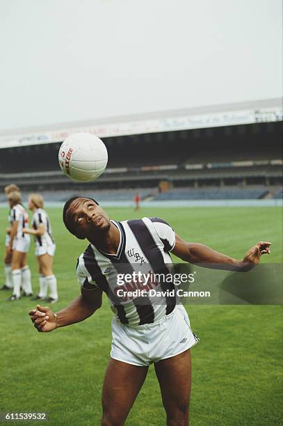 West Bromwich Albion and England striker Cyrille Regis in action during a photocall circa 1984 at the Hawthorns, in 1984 in West Bromwich, England