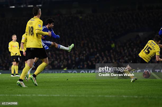 Chelsea's Diego Costa shoots at goal and is handled by Watfords Craig Cathcart but Referee played the advantage during a FA Cup 3rd Round match...