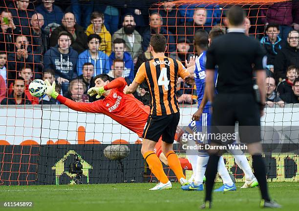 Chelsea's Thibaut Courtois saves a shot from Hull City's Alex Bruce