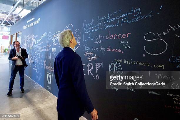 Secretary of State John Kerry reviewing his message on the Facebook wall at their headquarters, Menlo Park, California, June 23, 2016. Image courtesy...