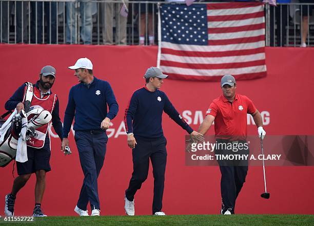 Team Europe Justin Rose Team USA Jordan Spieth and Patrick Reed walk during the Morning Foursome matches at the 41st Ryder Cup at Hazeltine National...