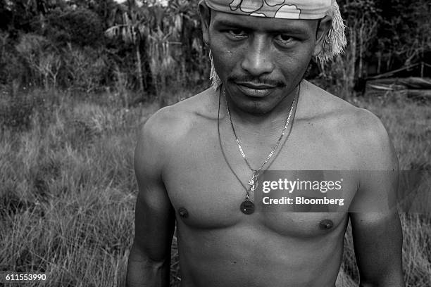 Image has been converted to black and white.) Revolutionary Armed Forces of Colombia rebel Franco Garcia, 35 years old, stands for a photograph...