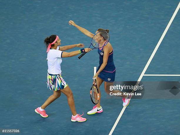 Sania Mirza and Barbora Strycova of Czech Republic celebrate after winning the semi-final match against Hao-Ching Chan of Chinese Taipei and Yung-Jan...