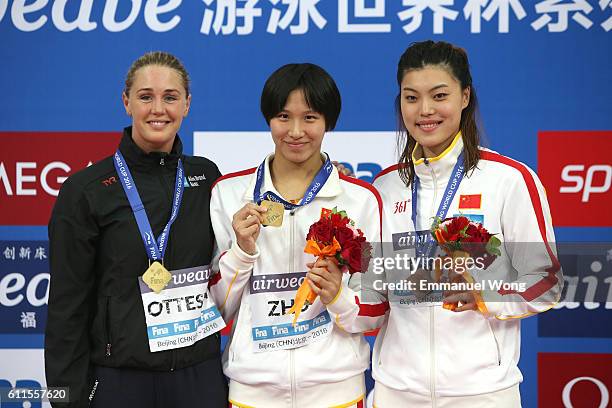 Gold medalist Zhu Menghui of China,Gold medalist Jeanette Ottesen of Denmark and bronze medalist Tang Yi of China poses during the medal ceremony for...