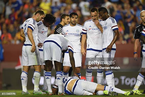 Chelsea's Gary Cahill lays injured after scoring the equaliser during a Pre Season Friendly match between Barcelona and Chelsea at FedEx Field on...