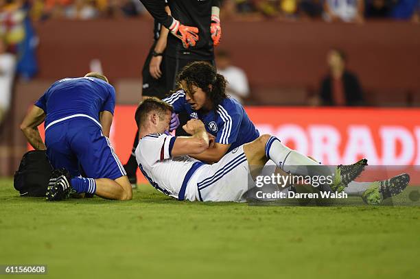 Chelsea's Gary Cahill lays injured after scoring the equaliser and is treated by Dr Eva Carneiro and Jon Fearn during a Pre Season Friendly match...