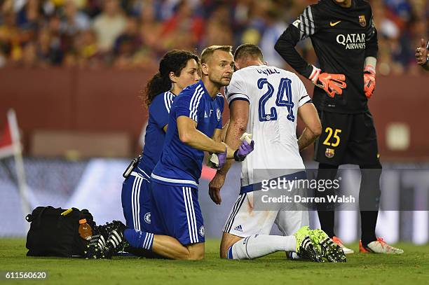 Chelsea's Gary Cahill lays injured after scoring the equaliser and is treated by Dr Eva Carneiro and Jon Fearn during a Pre Season Friendly match...