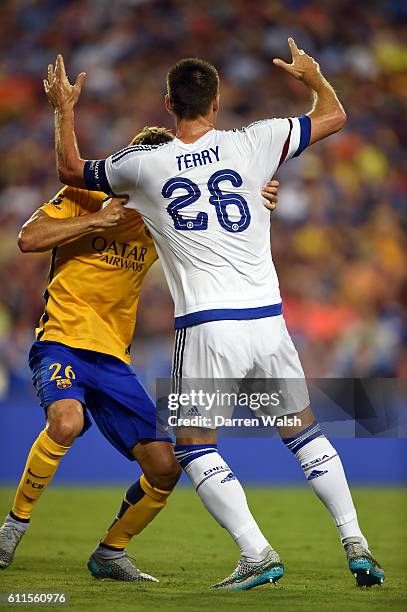 Chelsea's John Terry and some hugging by Barcelons's Sergi Samper during a Pre Season Friendly match between Barcelona and Chelsea at FedEx Field on...