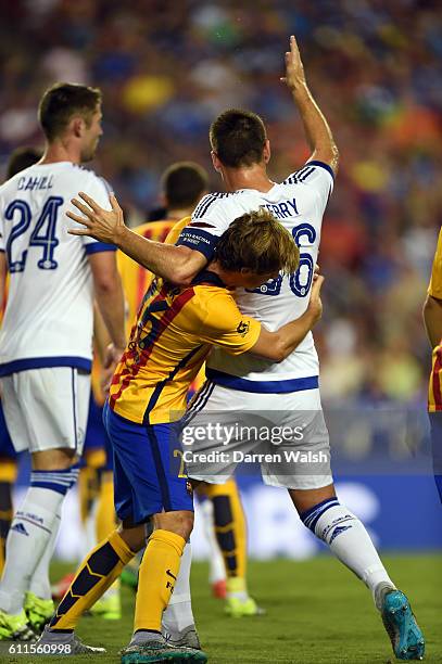 Chelsea's John Terry and some hugging by Barcelons's Sergi Samper during a Pre Season Friendly match between Barcelona and Chelsea at FedEx Field on...