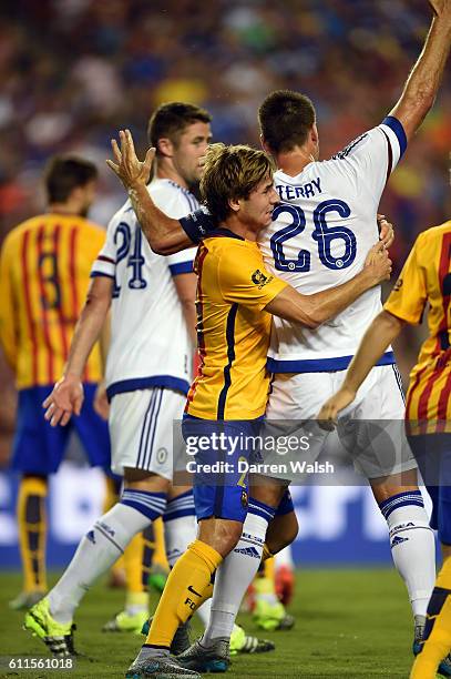 Chelsea's John Terry and some hugging by Barcelons's Sergi Samper during a Pre Season Friendly match between Barcelona and Chelsea at FedEx Field on...