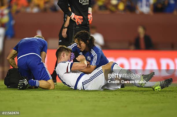 Chelsea's Jon Fearn and Dr Eva Carneiro treat Gary Cahill after his goal during a Pre Season Friendly match between Barcelona and Chelsea at FedEx...