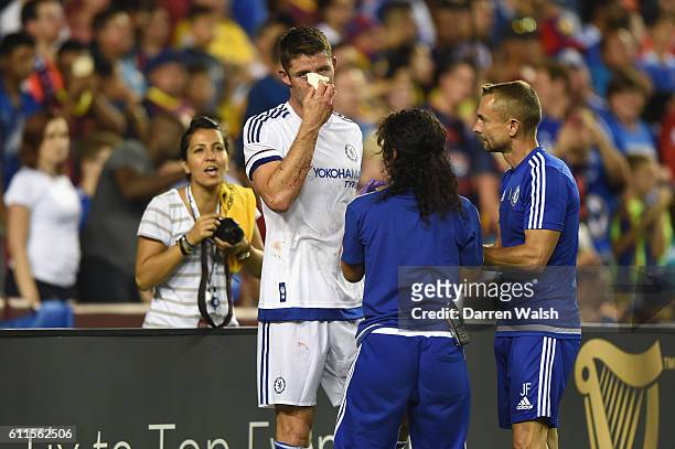 Chelsea's Jon Fearn and Dr Eva Carneiro treat Gary Cahill after his goal during a Pre Season Friendly match between Barcelona and Chelsea at FedEx...