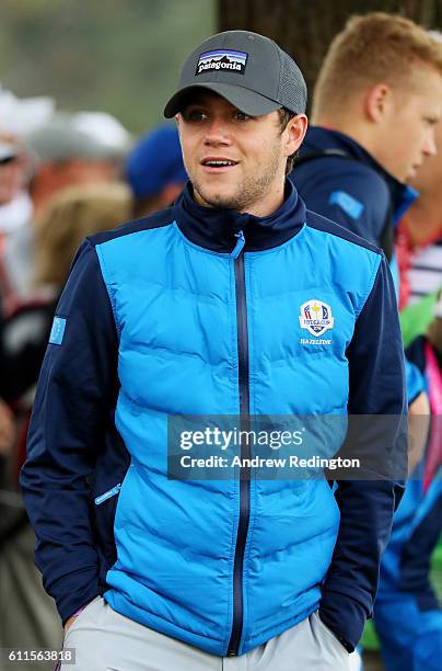 Singer Niall Horan of One Direction looks on during morning foursome matches of the 2016 Ryder Cup at Hazeltine National Golf Club on September 30,...