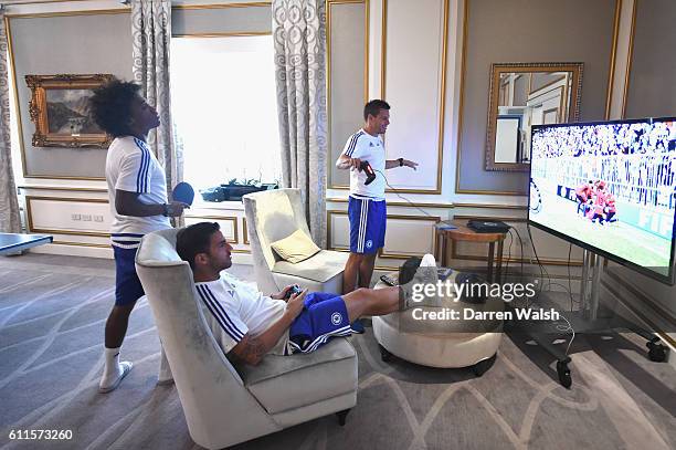 Chelsea's Cesar Azpilicueta, Cesc Fabregas and Willian play Fifa 15 on the Playstation during down time at the hotel on 27th July 2015 at the...