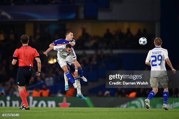 Chelsea's John Terry and Dynamo Kiev's Moraes battle for the ball in the air