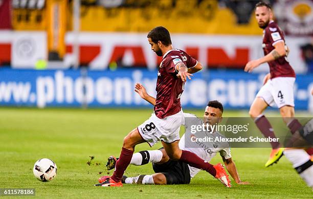 Andrew Wooten of Sandhausen challenges Nils Teixeira of Dresden during the Second Bundesliga match between SV Sandhausen and SG Dynamo Dresden at...