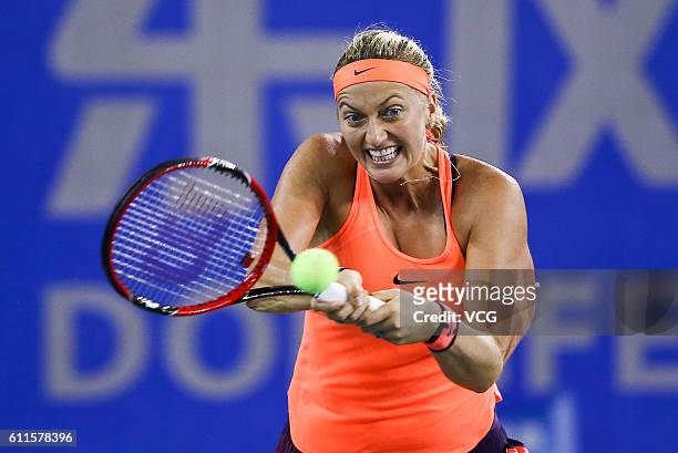 Petra Kvitova of the Czech Republic returns a shot during the women's singles semi-final match against Simona Halep of Romania on day six of the 2016...