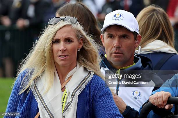 Caroline Harrington and vice-captain Padraig Harrington of Europe look on during morning foursome matches of the 2016 Ryder Cup at Hazeltine National...