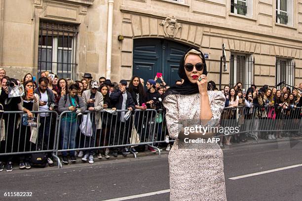 Russian designer Ulyana Sergeenko poses for a picture during the fashion week in Paris on September 30, 2016. / AFP / STRINGER