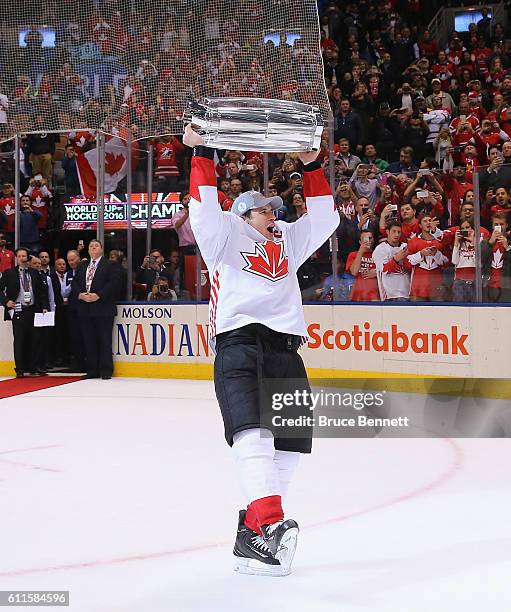 Sidney Crosby of Team Canada carries the World Cup of Hockey Trophy after Canada defeated Europe 2-1 during Game Two of the World Cup of Hockey final...