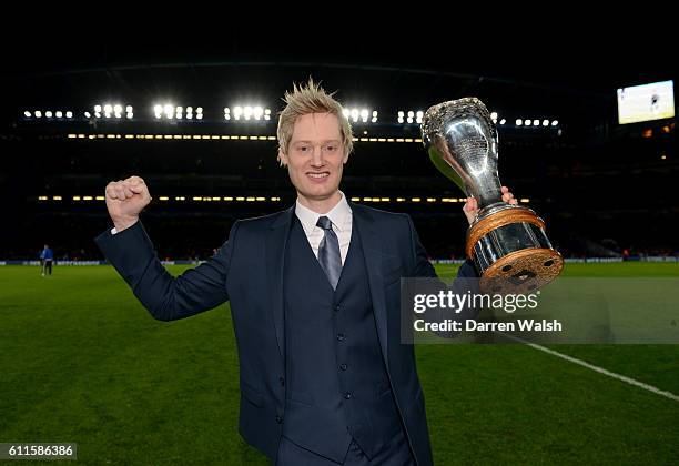 Snooker Championship winner Neil Robertson on the pitch with his trophy