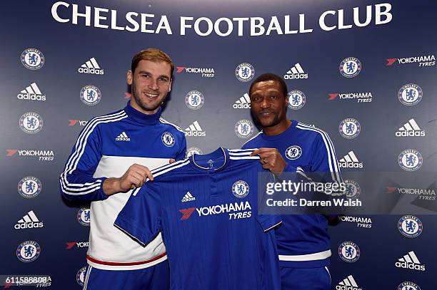 Chelsea's Branislav Ivanovic with Chelsea's Technical Director Michael Emenalo after signing a new 1 year contract with Chelsea FC at the Cobham...