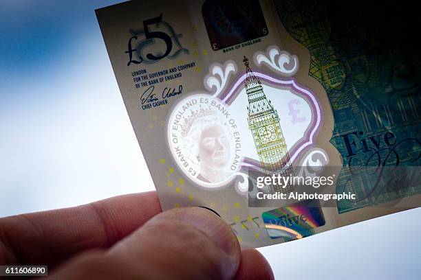 new 5 pound note - releasing money stock pictures, royalty-free photos & images