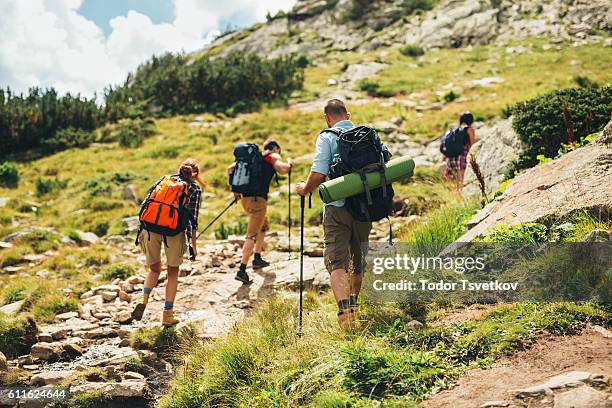 mountain hiking - people climbing walking mountain group stock pictures, royalty-free photos & images